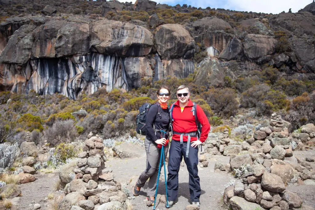 Two backpackers trekking on Mount Kilimanjaro